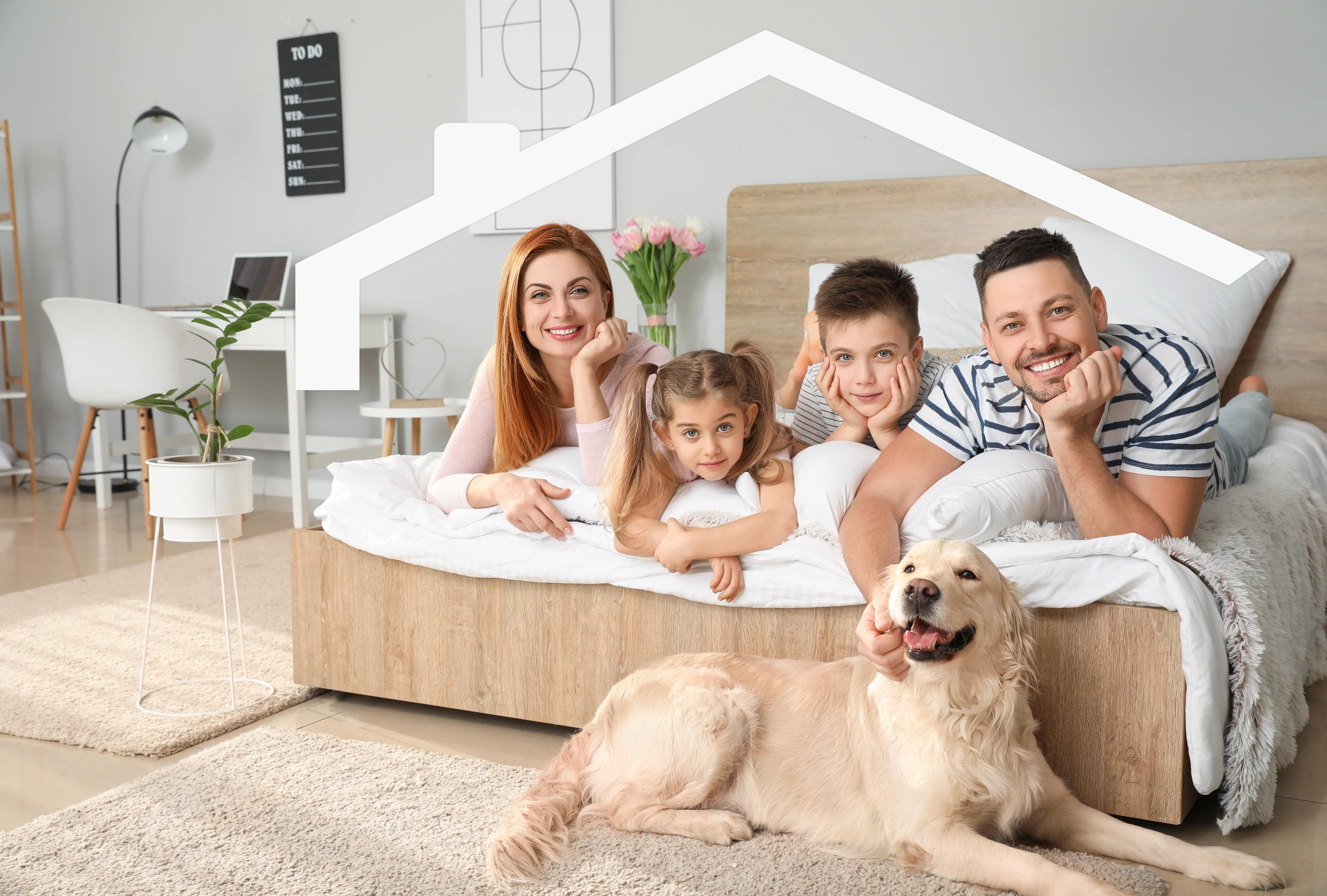 Rodzina na łóżku z psem