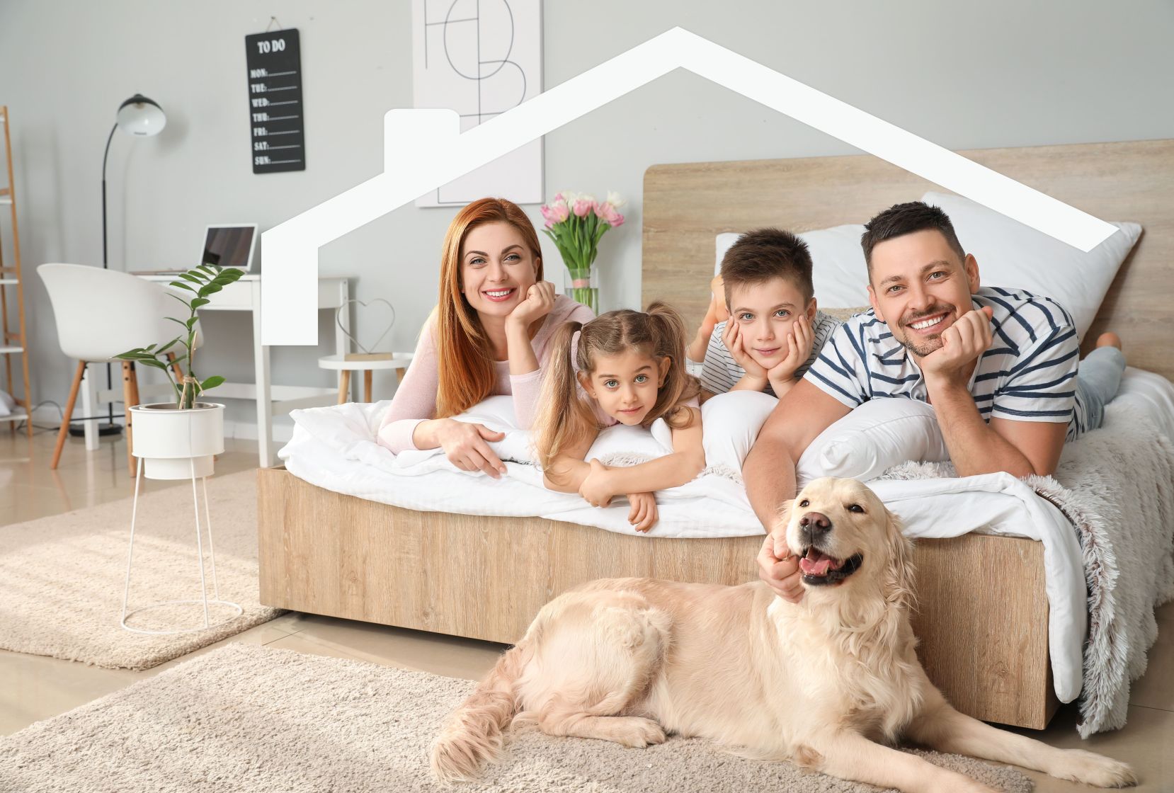 Rodzina na łóżku z psem